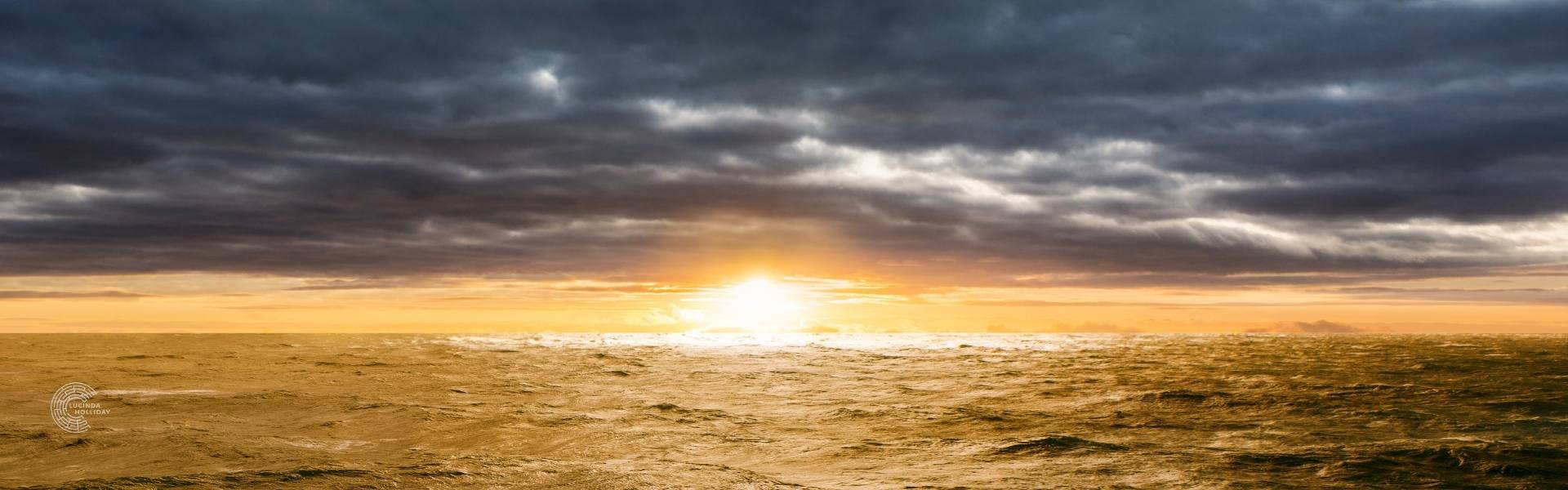Sun rising over a cloudy sea