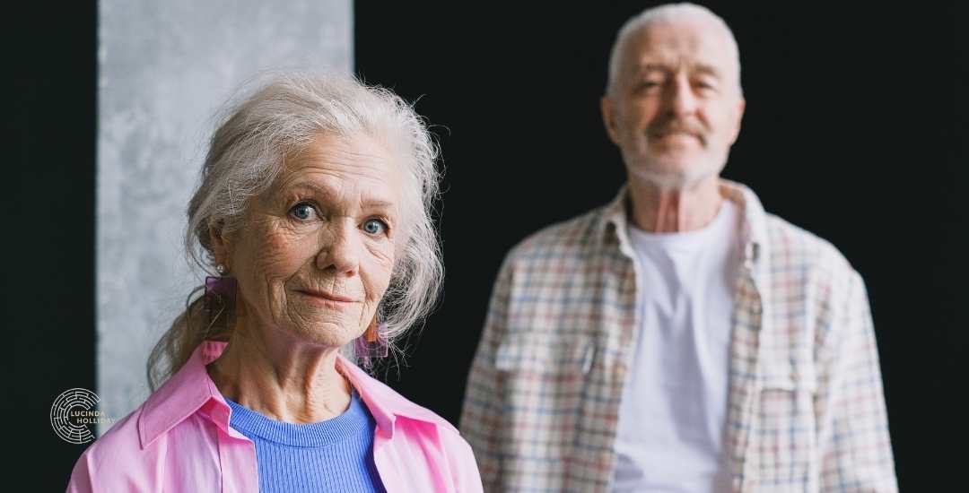 Unhappy elderly woman looking for divorce from husband in the background