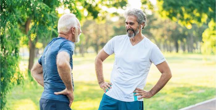 Elderly men adapting to divorce meeting in the park